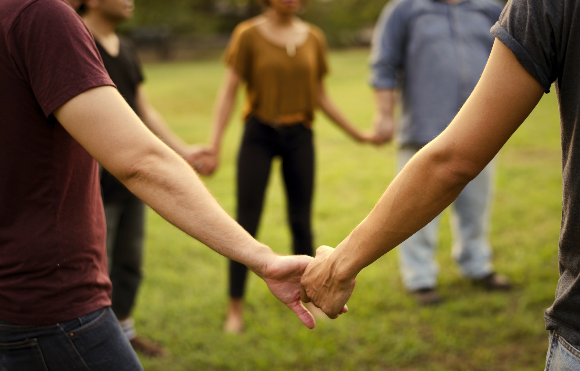 Group of people support unity arm around together
