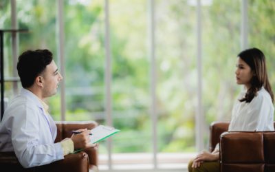 Mental Health concept, psychologist comforting his depressed patient