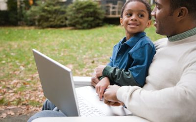 Father and son with laptop