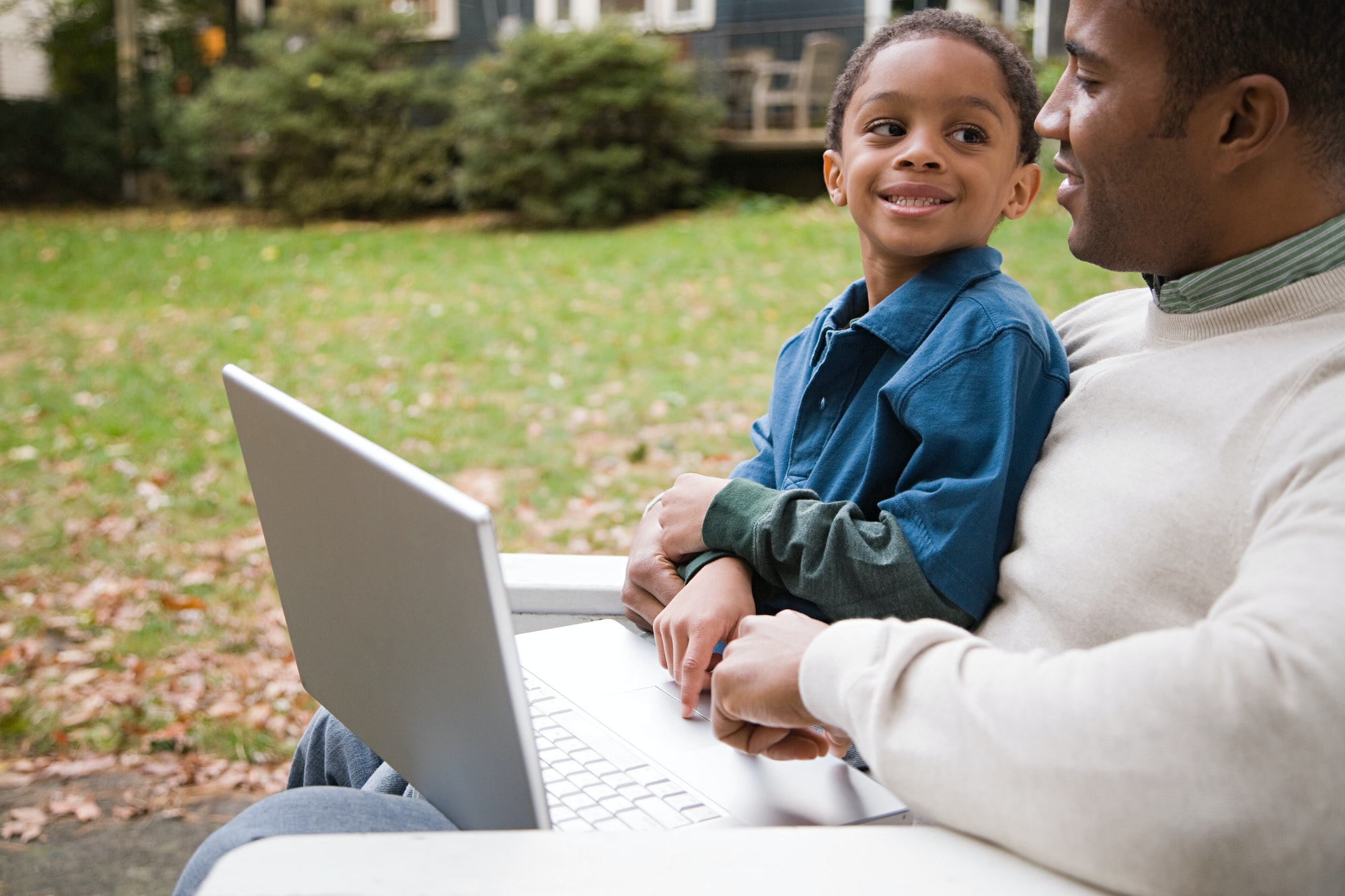 Father and son with laptop