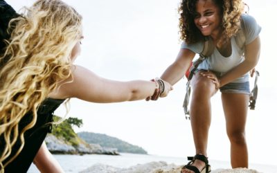 Young women helping each other