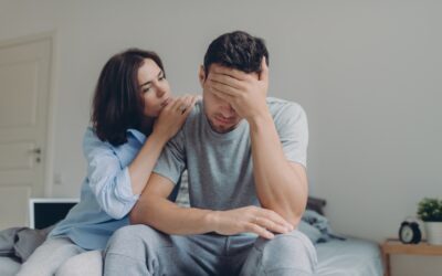 Female consoles her sad boyfriend who has depression and some problems, pose at bedroom on bed