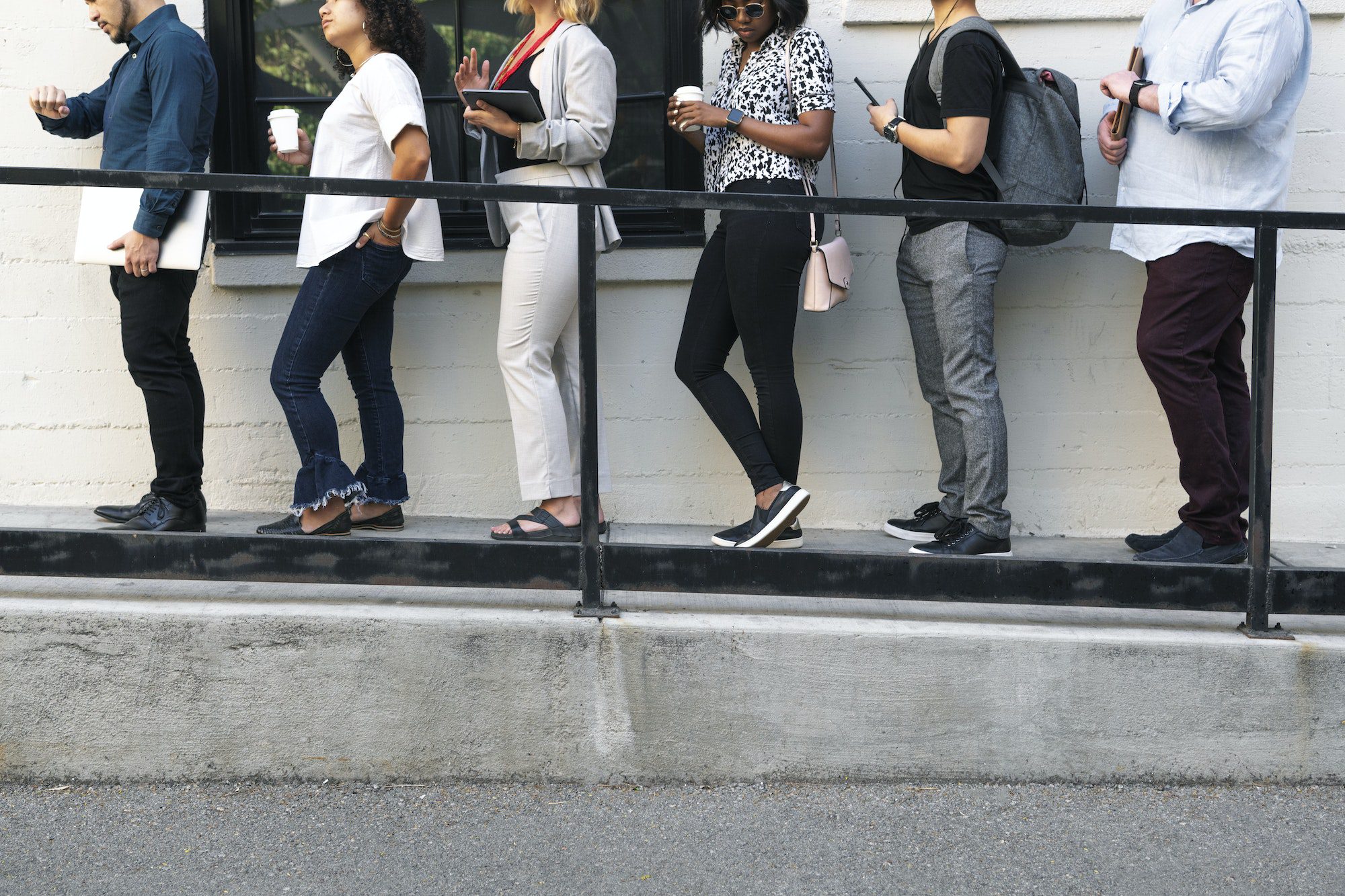 Diverse people standing in line