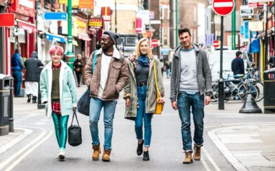 Multicultural students walking on Brick Lane center at Shoreditch London