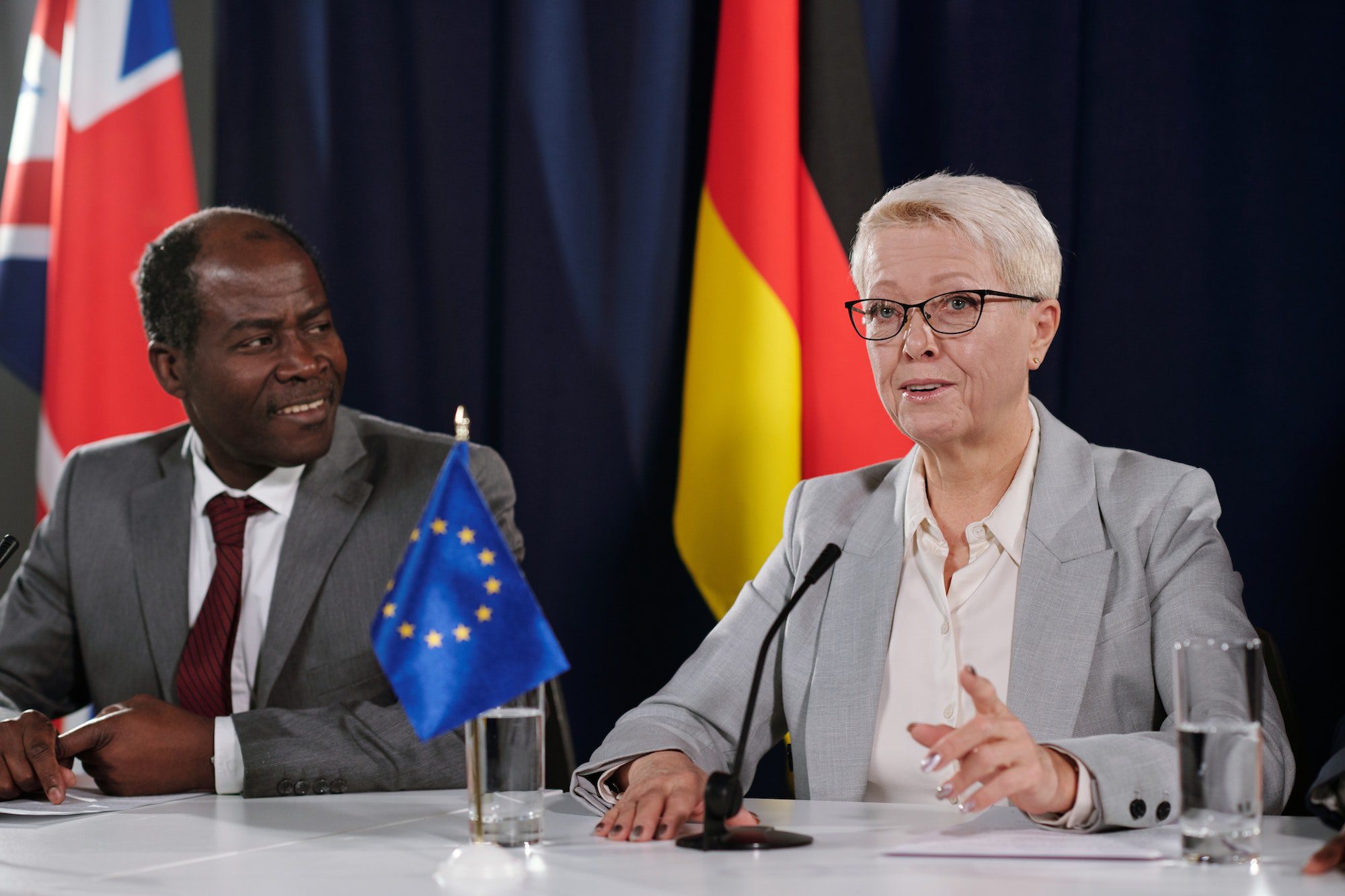 Mature blond female representative of European Union making speech