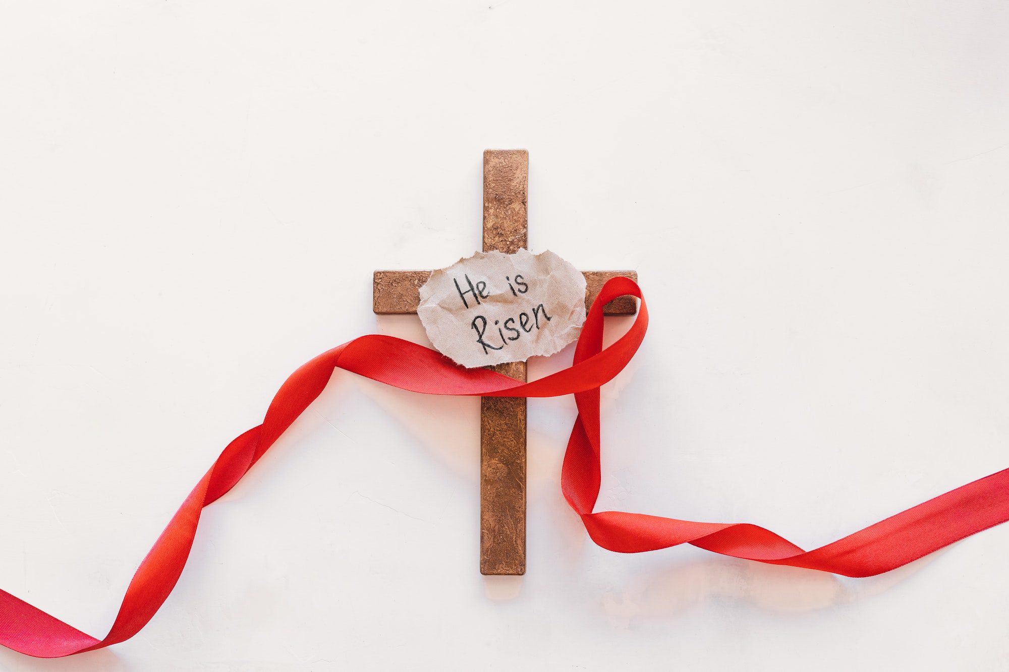 Cross with a red ribbon, a symbol of Christ. Crucifixion Of Jesus Christ. Easter Day
