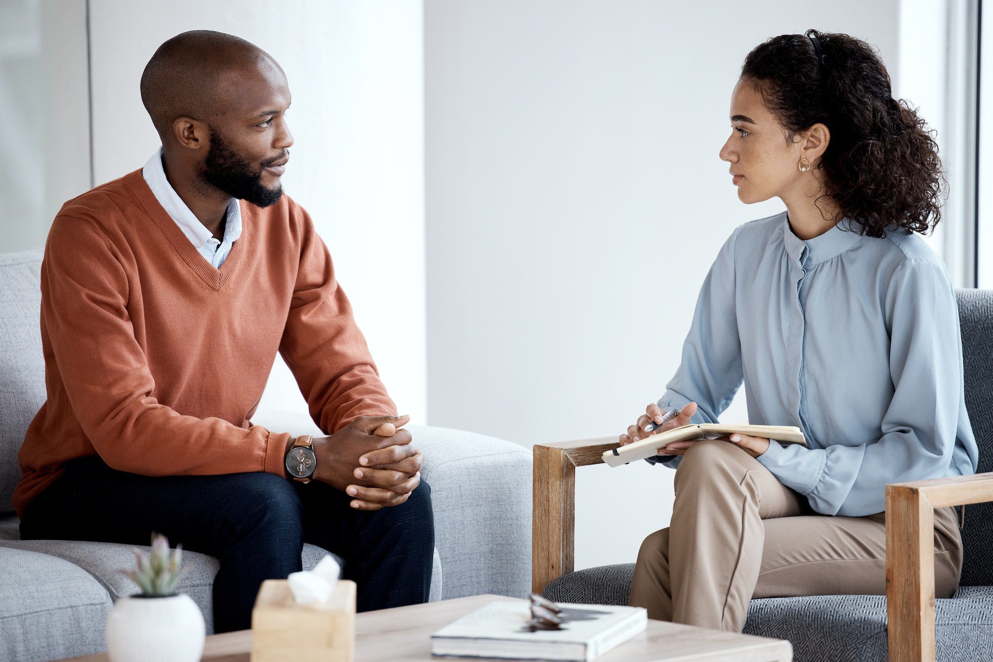 Psychology, counseling and black people, psychologist and client talking of mental health, stress o