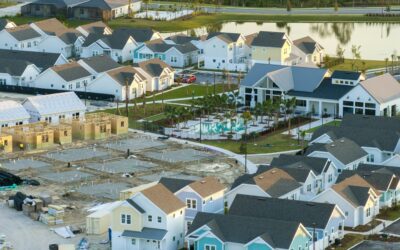 Aerial view of unfinished wooden frames of affordable houses under construction