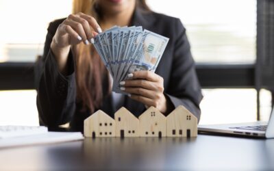 Real estate agent businesswoman counting cash, deposit or commission on real estate sales.