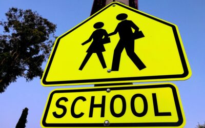 School zone crossing sign with people