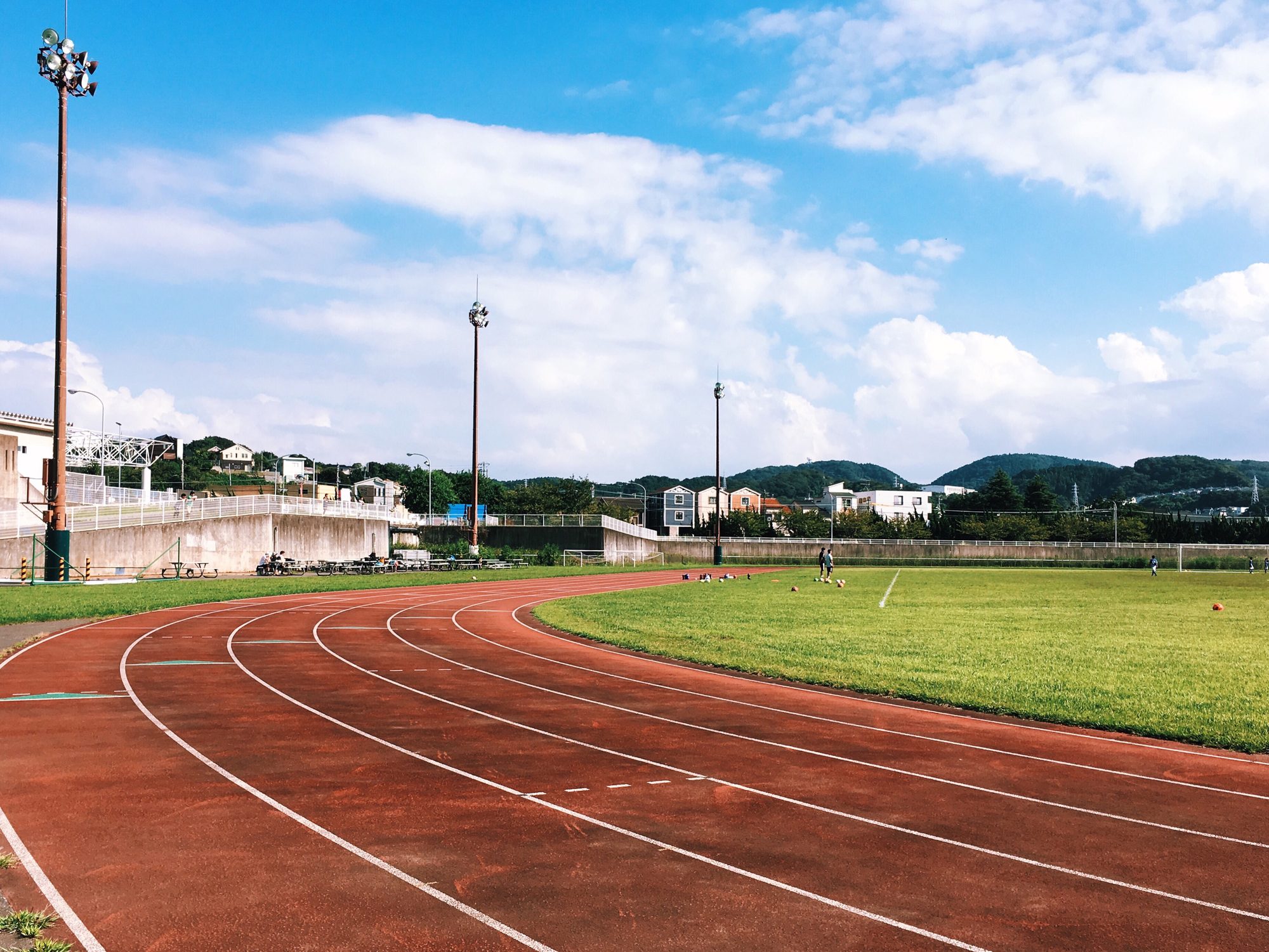 Running track on a sunny day. Track and field. Stadium. Athletics, exercise.