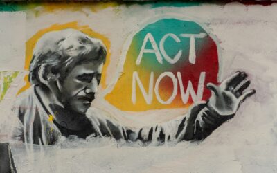man saying act now painting